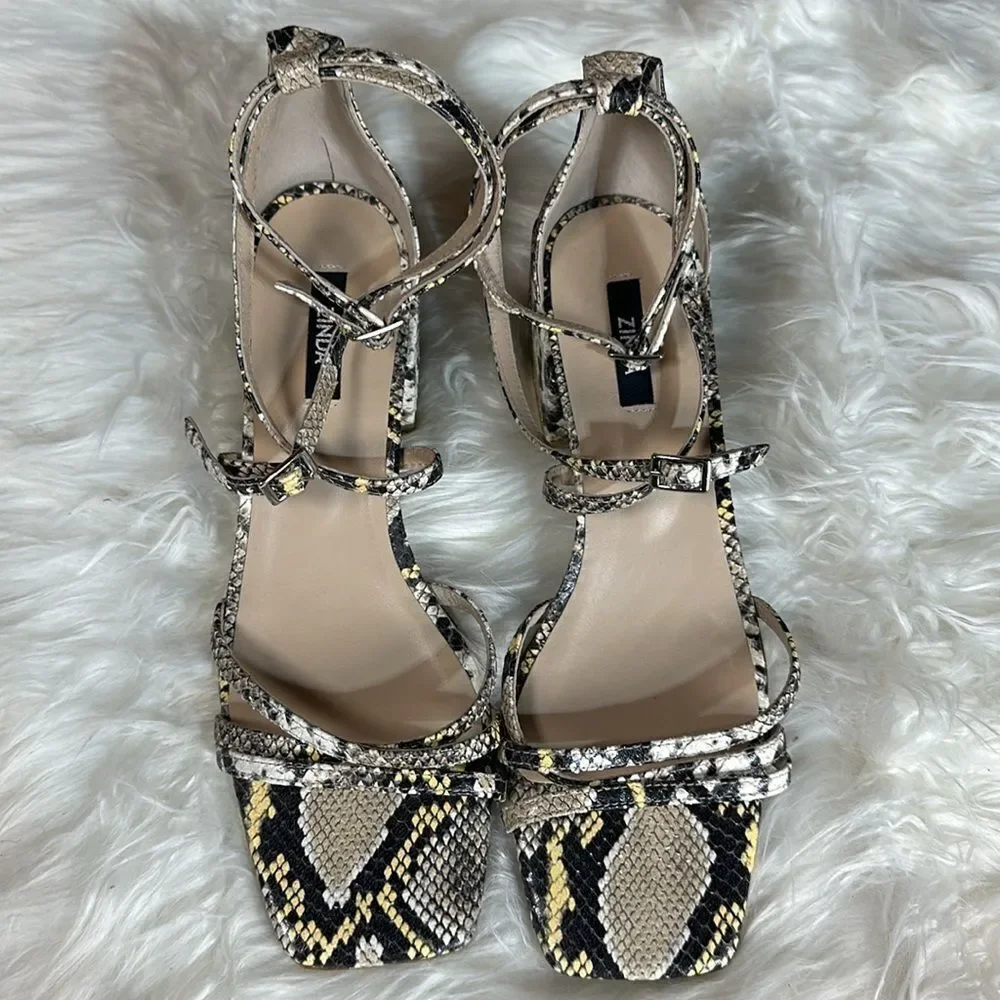 Unworn snake print wedges